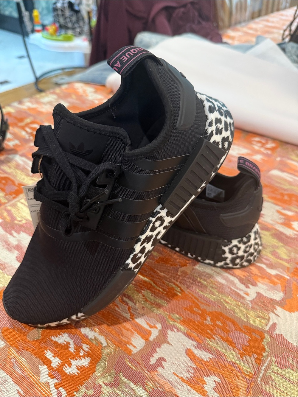 Adidas NMD R1 W women’s size 10 w/Cheetah print sole.